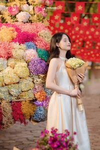 Radiant Vietnamese Girl Amidst a Sea of Vibrant Flowers-6