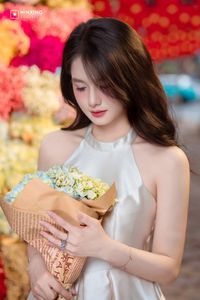 Radiant Vietnamese Girl Amidst a Sea of Vibrant Flowers-5