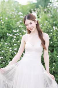 XVG No.19: Radiant Bride: Beautiful Woman in Elegant White Gown with a Joyful Smile in Lush Green Setting.-21
