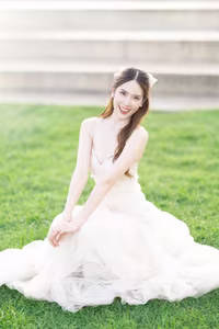 XVG No.19: Radiant Bride: Beautiful Woman in Elegant White Gown with a Joyful Smile in Lush Green Setting.-9