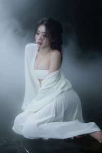 Ethereal Woman in White Dress Amidst Misty Haze Portrait-2