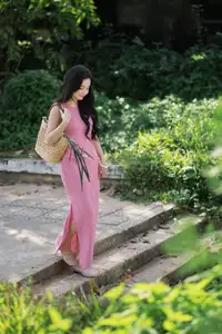 Captivating Grace: Long-Haired Beauty in Soft Pink Evokes Dreamy Serenity.-3