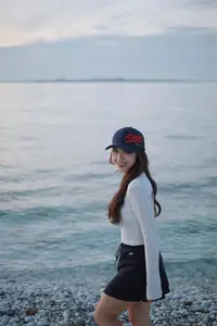 Dreamy Sunset by the Sea: Young Woman Relaxing and Gazing-2