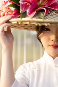Discover the captivating grace of a Vietnamese woman in a flowing white Ao Dai and traditional conical hat-2