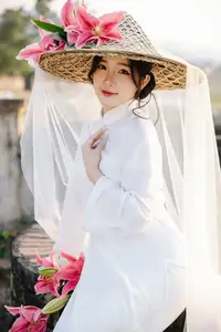 Discover the captivating grace of a Vietnamese woman in a flowing white Ao Dai and traditional conical hat-4
