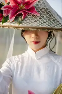 Discover the captivating grace of a Vietnamese woman in a flowing white Ao Dai and traditional conical hat-15
