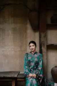 Elegant Asian Beauty: Serene Woman in Modernized Traditional Dress with Vintage Floral Vase-6