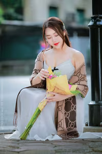 VGU No.88: Captivating Elegance A Young Woman's Gentle Beauty with a Lotus Bouquet-1