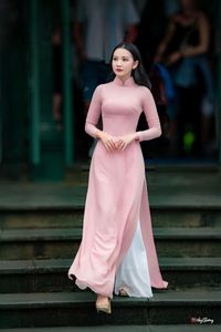 Graceful Vietnamese Woman in Pink Ao Dai: A Stunning Portrayal of Traditional Asian Beauty 1000019457-4