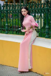 Graceful Vietnamese Woman in Pink Ao Dai: A Stunning Portrayal of Traditional Asian Beauty 1000019457-7