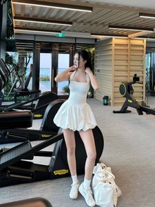 Gym Fashionista: Elegant woman in white bubble dress at a modern fitness center-2