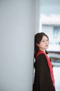 Radiant Student in Graduation Gown Captures Memorable Moment of Success and Joy for a Bright Future.-0