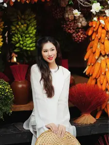 Pure Elegance of White Ao Dai in Traditional Vietnamese Setting-7