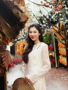 Pure Elegance of White Ao Dai in Traditional Vietnamese Setting-2
