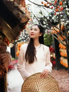 Pure Elegance of White Ao Dai in Traditional Vietnamese Setting-5