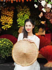 Pure Elegance of White Ao Dai in Traditional Vietnamese Setting-6