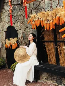 Pure Elegance of White Ao Dai in Traditional Vietnamese Setting-9