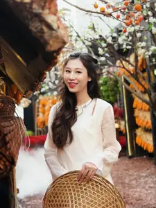 Pure Elegance of White Ao Dai in Traditional Vietnamese Setting-4