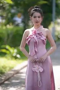 Gentle Charm: A Girl in an Elegant Pink Dress Amidst Nature's Embrace-6