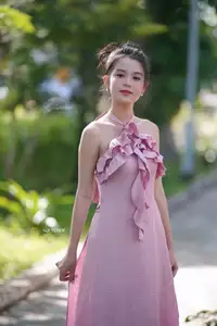 Gentle Charm: A Girl in an Elegant Pink Dress Amidst Nature's Embrace-10