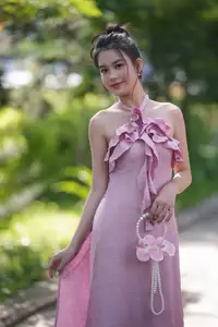 Gentle Charm: A Girl in an Elegant Pink Dress Amidst Nature's Embrace-3