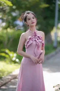 Gentle Charm: A Girl in an Elegant Pink Dress Amidst Nature's Embrace-9