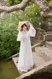 Elegant White Ao Dai with Pink Lotus Flower Embracing Cultural Heritage-8