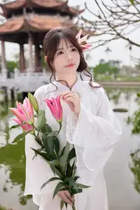 Elegant White Ao Dai with Pink Lotus Flower Embracing Cultural Heritage-2