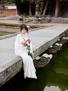 Elegant White Ao Dai with Pink Lotus Flower Embracing Cultural Heritage-13