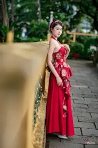 Elegant Asian Beauty in Red Dress Shines Gracefully Amidst a Traditional Garden 1000024509-8
