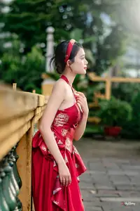 Elegant Asian Beauty in Red Dress Shines Gracefully Amidst a Traditional Garden 1000024509-3