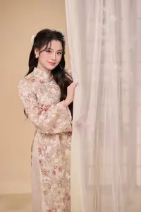 Graceful Vietnamese Woman Unveiled: Elegant Modern Ao Dai with Intricate Floral Patterns-3