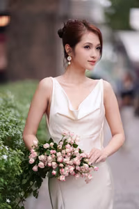 VGU No.11: Elegant Charm: A Woman's Grace in White Gown and Delicate Rose Bouquet-3