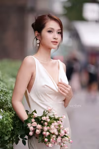 VGU No.11: Elegant Charm: A Woman's Grace in White Gown and Delicate Rose Bouquet-5