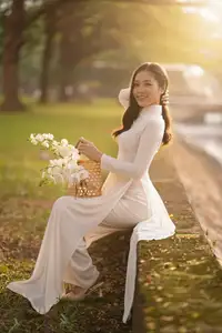 Serene Vietnamese Beauty in White Ao Dai Bathed in Golden Sunset Light-3