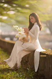 Serene Vietnamese Beauty in White Ao Dai Bathed in Golden Sunset Light-4