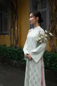 Graceful Vietnamese Woman in Light Green Ao Dai Amidst Tranquil Garden-8
