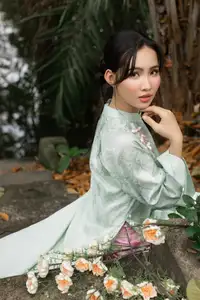 Graceful Vietnamese Woman in Light Green Ao Dai Amidst Tranquil Garden-6