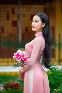 VGU No.158: Discover the Timeless Grace of Vietnamese Beauty in a Stunning Pink Ao Dai-1