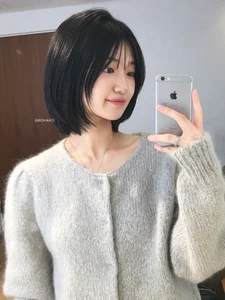 Timeless elegance of classic black bob hair amidst the lush green forest-1