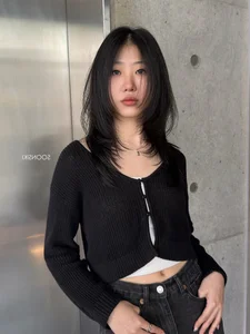 Timeless elegance of classic black bob hair amidst the lush green forest-2