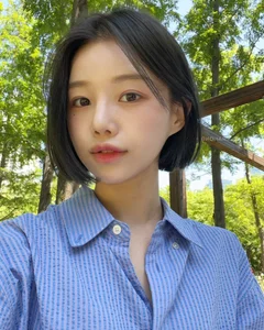 Timeless elegance of classic black bob hair amidst the lush green forest-0