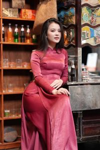 Discover Vietnamese Ao Dai Beauty: Elegant, Graceful Girl in a Cafe Setting-17