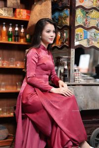 Discover Vietnamese Ao Dai Beauty: Elegant, Graceful Girl in a Cafe Setting-15