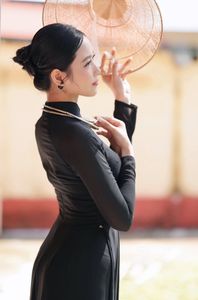 Graceful Vietnamese Woman in Elegant Black Ao Dai-1