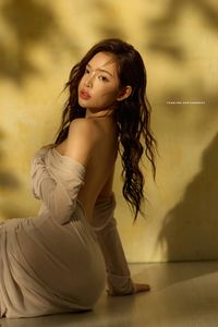 Elegant Allure: Woman's Grace in Shadow Play-10