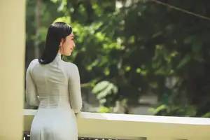 Elegant Vietnamese Woman in White Ao Dai: A Portrait of Traditional Grace and Conical Hat-5