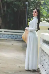 Elegant Vietnamese Woman in White Ao Dai: A Portrait of Traditional Grace and Conical Hat-2