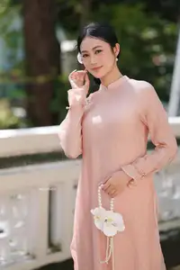 Timeless Beauty: Elegant Vietnamese Girl in Graceful Pink Ao Dai 1000024694-0