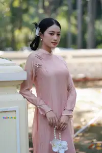 Timeless Beauty: Elegant Vietnamese Girl in Graceful Pink Ao Dai 1000024694-5